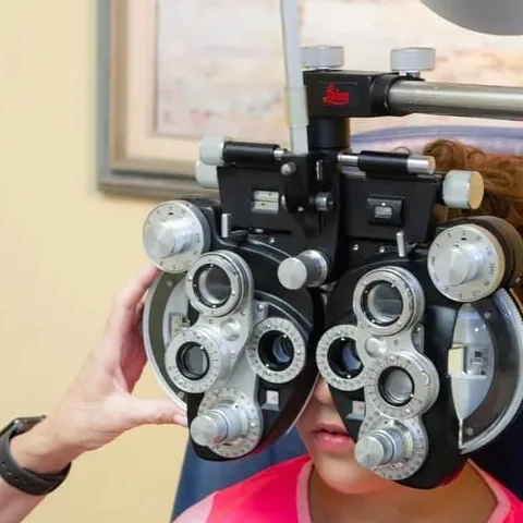 A phoropter during a comprehensive eye exam